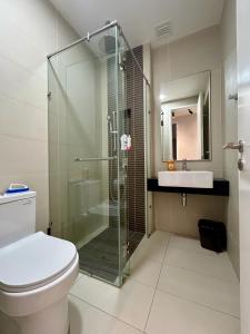 a bathroom with a shower and a toilet and a sink at KL Central 33rd Floor KLCC view in Kuala Lumpur +15 photos