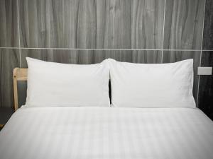 Postel nebo postele na pokoji v ubytování Shigang Homestay市港行旅