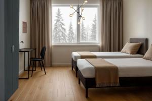 Postel nebo postele na pokoji v ubytování Academy Hotel Kemijärvi