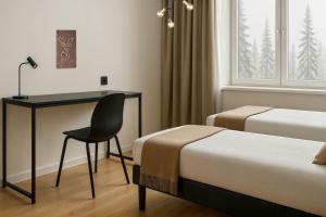 Postel nebo postele na pokoji v ubytování Academy Hotel Kemijärvi