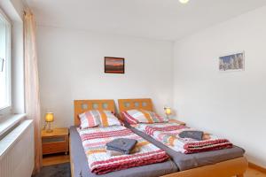 Postel nebo postele na pokoji v ubytování Haus Marion