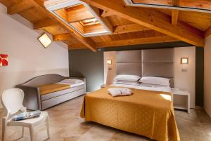 Postel nebo postele na pokoji v ubytování Hotel Giuliana
