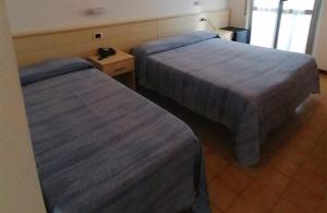 Postel nebo postele na pokoji v ubytování Hotel Holiday Garnì