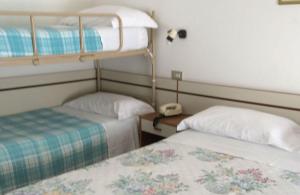 Postel nebo postele na pokoji v ubytování Hotel Holiday Garnì