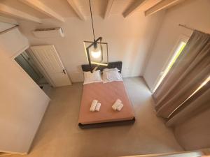 Postel nebo postele na pokoji v ubytování Dimitris Apartments