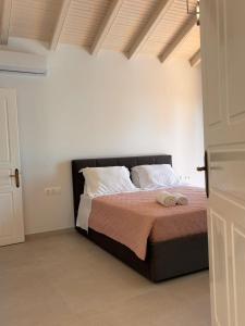 Postel nebo postele na pokoji v ubytování Dimitris Apartments