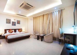 Fotografie z fotogalerie ubytování Hotel Blue Neck Hudda City Centre Fortis Hospital v destinaci Gurgáon + 16 fotografií