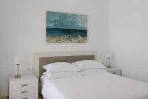 Postel nebo postele na pokoji v ubytování Manolioudis Villas