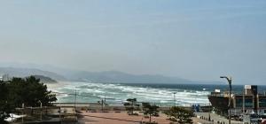 a view of a beach with the ocean at Donghae Goldenview Pension in Donghae
