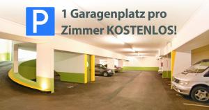 a parking garage with cars parked in it at Aktiv Hotel Zur Rose in Steinach am Brenner