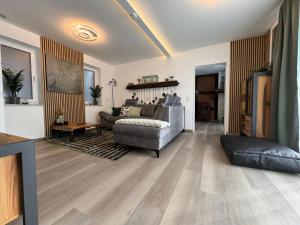 a living room with a couch and a table at Lilis Ferienwohnung mit Schlossblick 1 in Waldeck