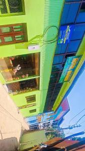 a close up of a building with green at HOTEl momin in Srinagar