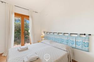 Ένα ή περισσότερα κρεβάτια σε δωμάτιο στο Mediterranean Garden House