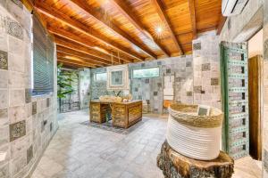 a bathroom with a sink and a wooden ceiling at Cortijo Boutique Marbella in Marbella