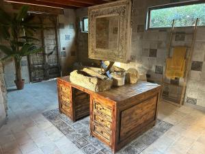 a bathroom with a wooden dresser and a mirror at Cortijo Boutique Marbella in Marbella