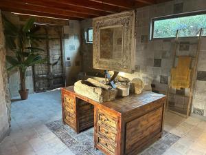 a bathroom with a wooden dresser and a mirror at Cortijo Boutique Marbella in Marbella