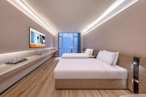 TV a/nebo společenská místnost v ubytování Crystal Orange Beijing South Railway Station Xitieying Hotel