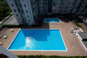 an overhead view of a swimming pool in a building at Belvedere in Lido Adriano