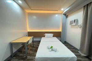 Postel nebo postele na pokoji v ubytování Hotel Ramon