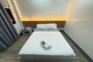 Postel nebo postele na pokoji v ubytování Hotel Ramon