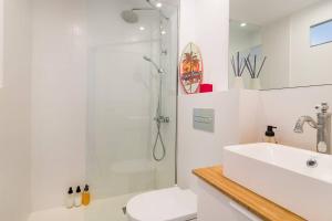 a bathroom with a shower and a sink and a toilet at Stunning & Stylish Apartment In Cadaqués in Cadaqués