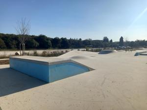 a skate park with a bunch of skate ramps at Apartman Renata in Pula