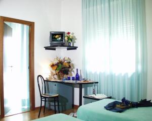 Postel nebo postele na pokoji v ubytování Hotel Paradiso