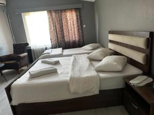 Postel nebo postele na pokoji v ubytování Butik Apart
