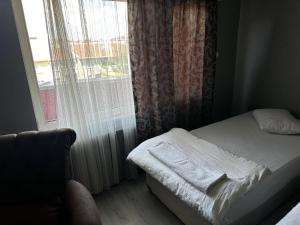 Postel nebo postele na pokoji v ubytování Butik Apart