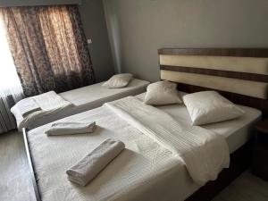 Postel nebo postele na pokoji v ubytování Butik Apart + 6 fotografií