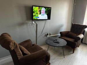 TV a/nebo společenská místnost v ubytování Butik Apart