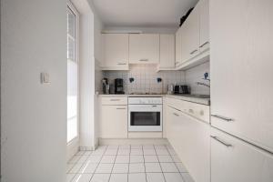 Η κουζίνα ή μικρή κουζίνα στο Fliedergang 2 Seebrise +12 φωτογραφίες