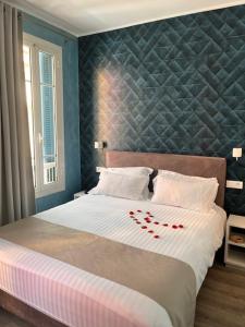 Postel nebo postele na pokoji v ubytování Hotel de charme Regency