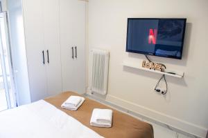 Μια τηλεόραση ή/και κέντρο ψυχαγωγίας στο Eve's Central Comfort Apartment #1 +23 φωτογραφίες