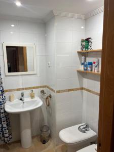 a bathroom with a sink and a toilet at MAGIC I a 1 minuto de la Catedral y Plaza Mayor in León