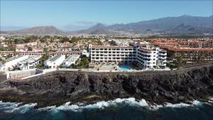 an aerial view of a resort near the ocean at Ladybug Ocean View in Costa Del Silencio