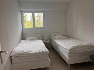 Ένα ή περισσότερα κρεβάτια σε δωμάτιο στο Appartement Panoramic