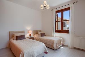 Postel nebo postele na pokoji v ubytování Aphrodite Hills Rentals - Superior Villas