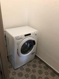 a washing machine in the corner of a room at A casa di Giuly (Monolocale) in Ceriale