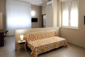 a living room with a couch and a table at Green Wave in Monopoli