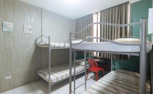 Voodi või voodid majutusasutuse Rcee Place by RedDoorz toas