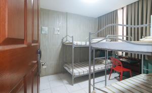 Voodi või voodid majutusasutuse Rcee Place by RedDoorz toas