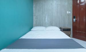 Voodi või voodid majutusasutuse Rcee Place by RedDoorz toas