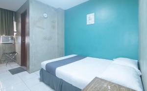 Voodi või voodid majutusasutuse Rcee Place by RedDoorz toas