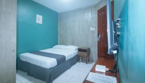 Voodi või voodid majutusasutuse Rcee Place by RedDoorz toas