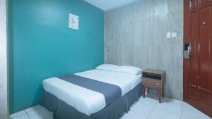 Voodi või voodid majutusasutuse Rcee Place by RedDoorz toas