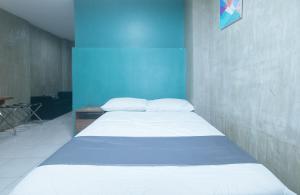 Voodi või voodid majutusasutuse Rcee Place by RedDoorz toas
