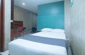 Voodi või voodid majutusasutuse Rcee Place by RedDoorz toas