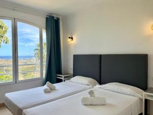 Postel nebo postele na pokoji v ubytování Villa Bellavista Calpe