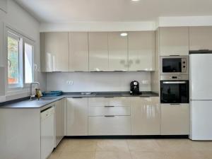 Kuchyň nebo kuchyňský kout v ubytování Villa Bellavista Calpe